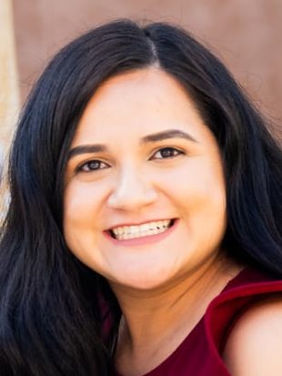 Rosa Mercado (middle) sitting with Community Resource Center team members
